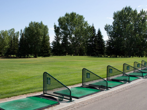 tree lined driving range at The Links at Spruce Grove