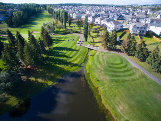 aerial view of fairways, sand bunkers, and water hazard at The Links at Spruce Grove