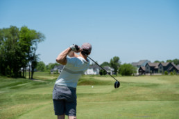 gofler drive swing off the tee box at The Links at Spruce Grove